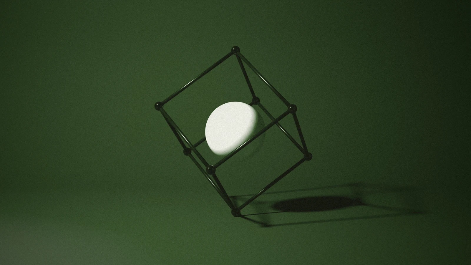 A wire cube balanced on one corner around a bone sphere